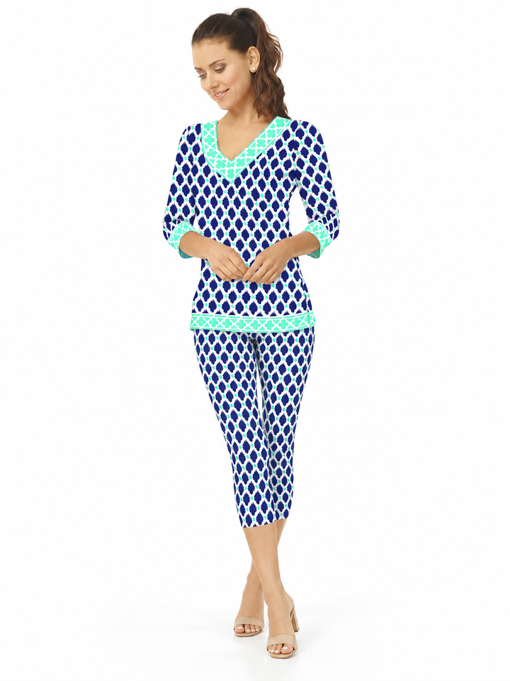 Woman wearing the Navy Seafoam knit top and matching capri, 2 piece set