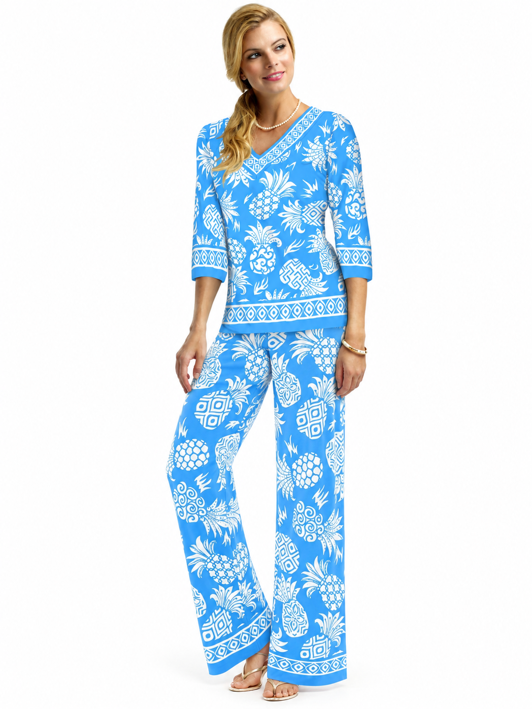 Woman wearing the Light Blue Pineapple knit top and matching palazzo pants, 2 piece set