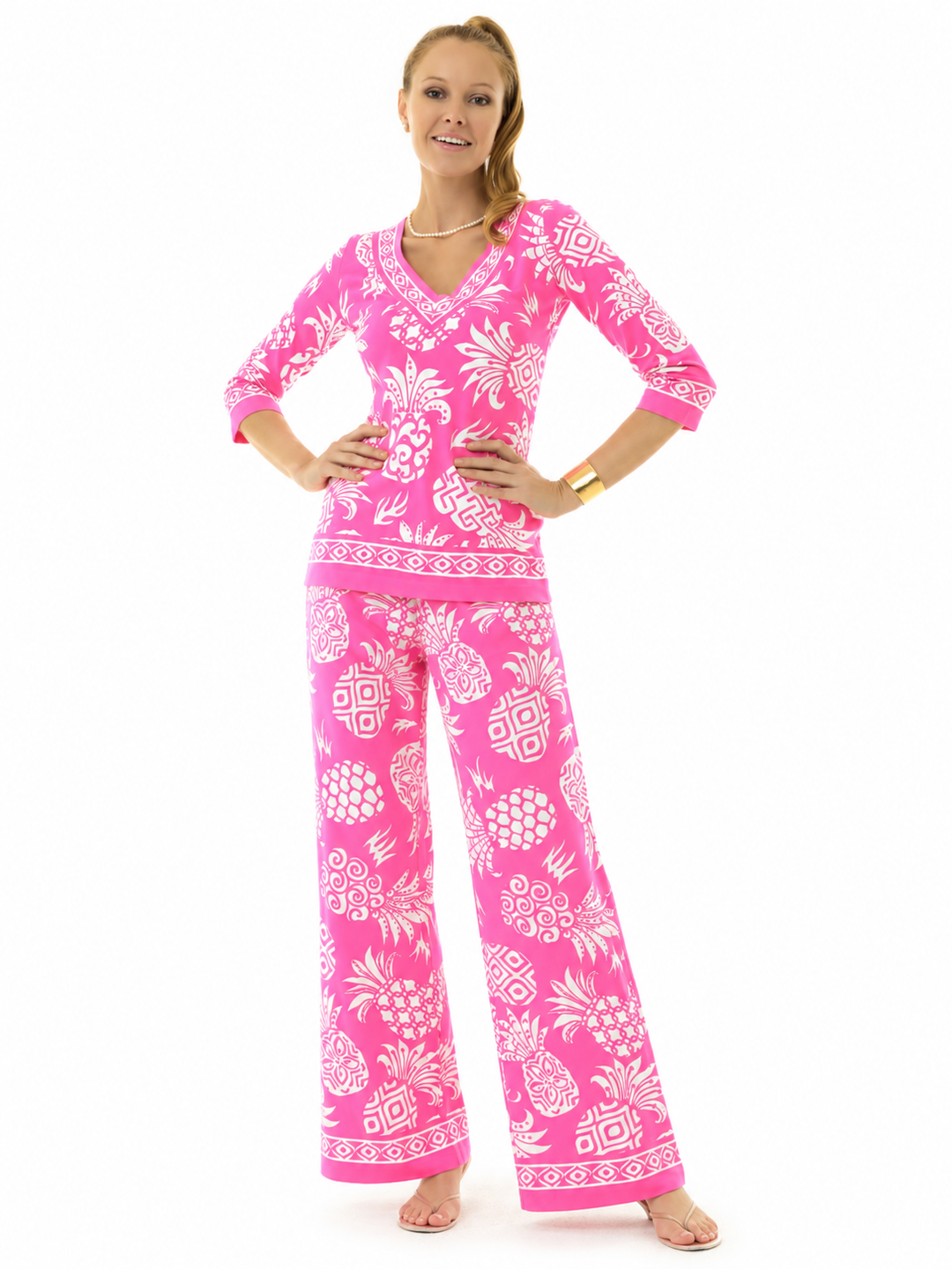 Woman wearing the Pink Pineapple knit top and matching palazzo pants, 2 piece set