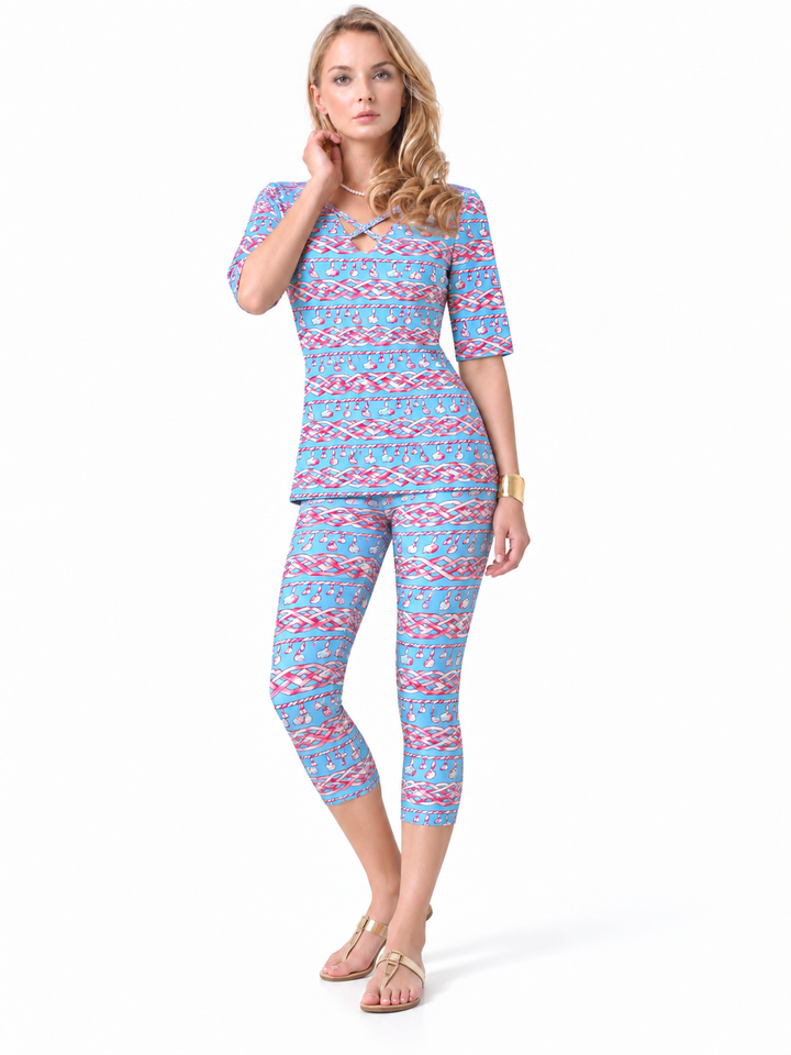 Woman wearing the Periwinkle Pink nylon reversible top and matching capri, 2 piece set