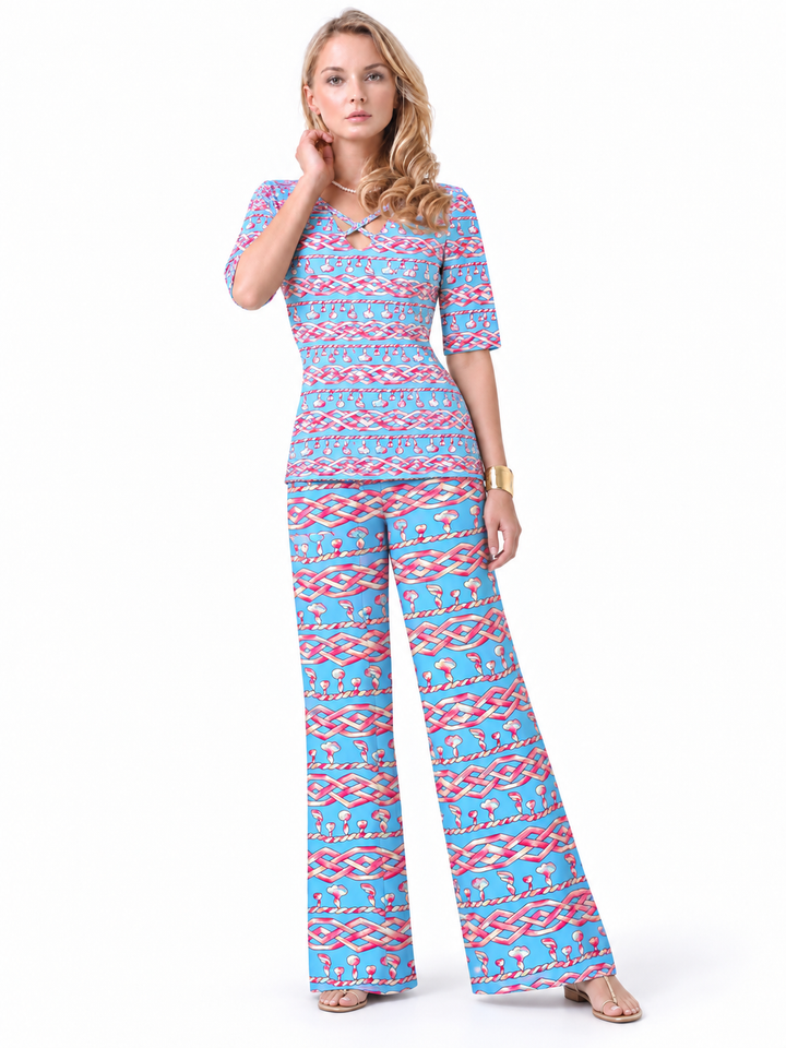 Woman wearing the Periwinkle Pink nylon reversible top and matching palazzo pants, 2 piece set