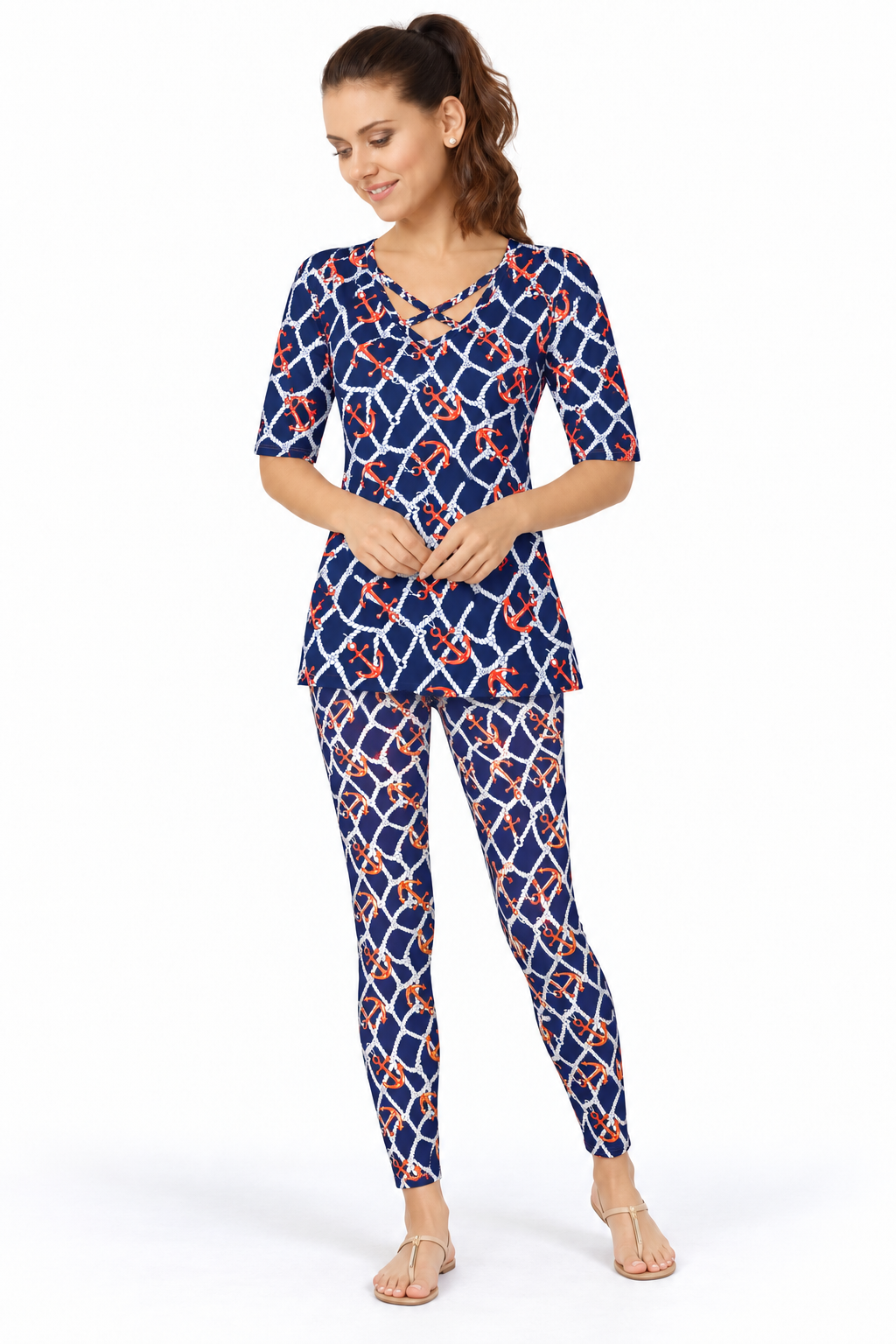 Woman wearing the Navy Orange nylon reversible top and matching leggings, 2 piece set
