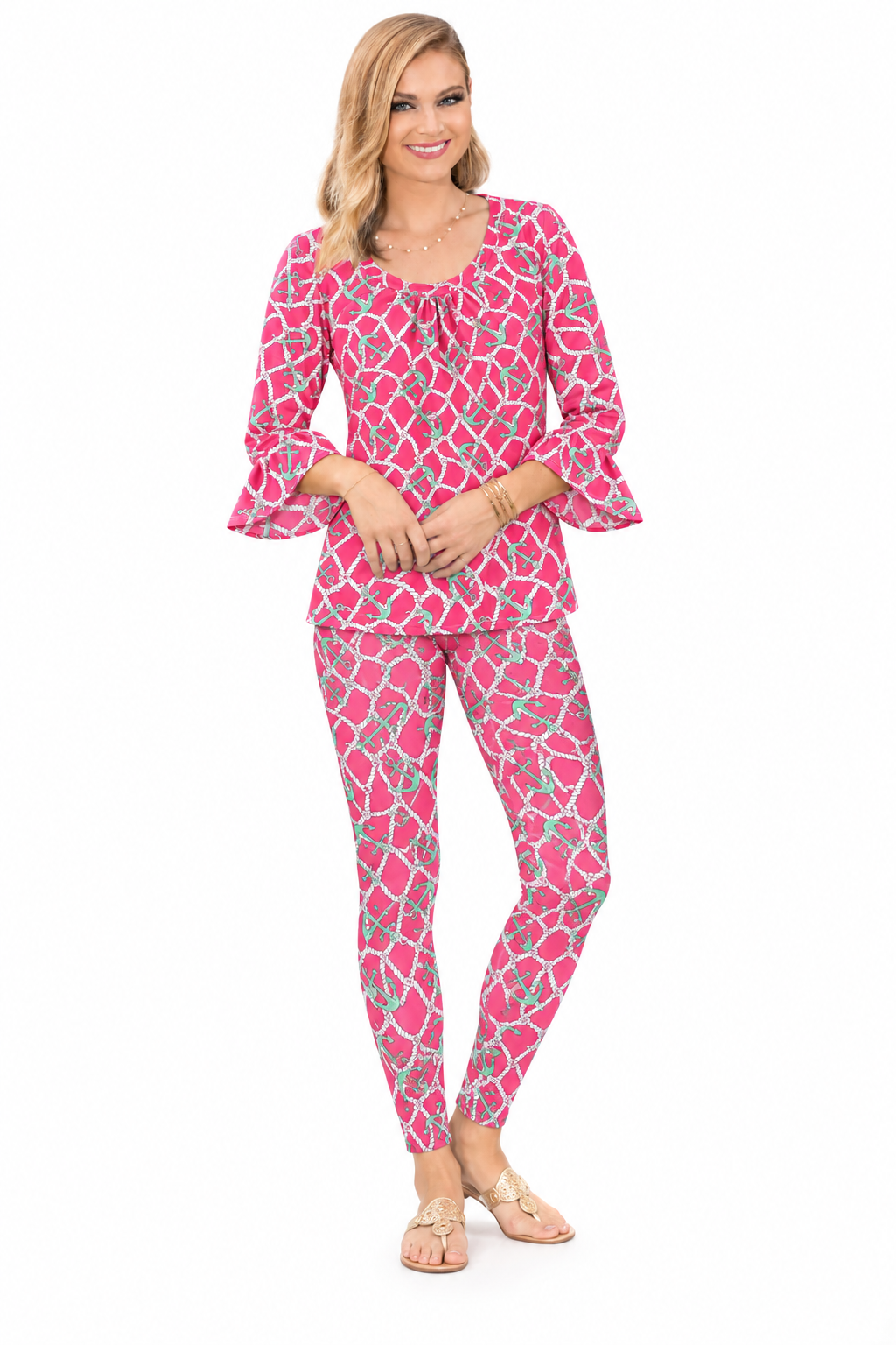 Woman wearing the Pink Seafoam nylon ruffle sleeve top and matching leggings, 2 piece set
