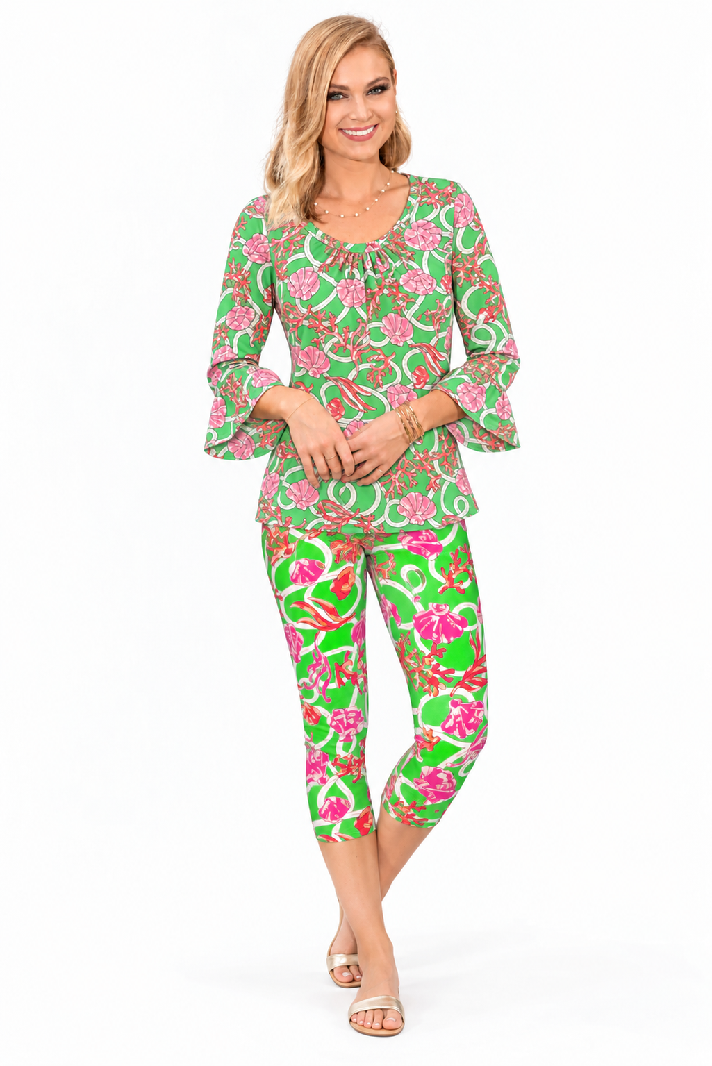 Woman wearing the Green Coral nylon ruffle sleeve top and matching capri, 2 piece set