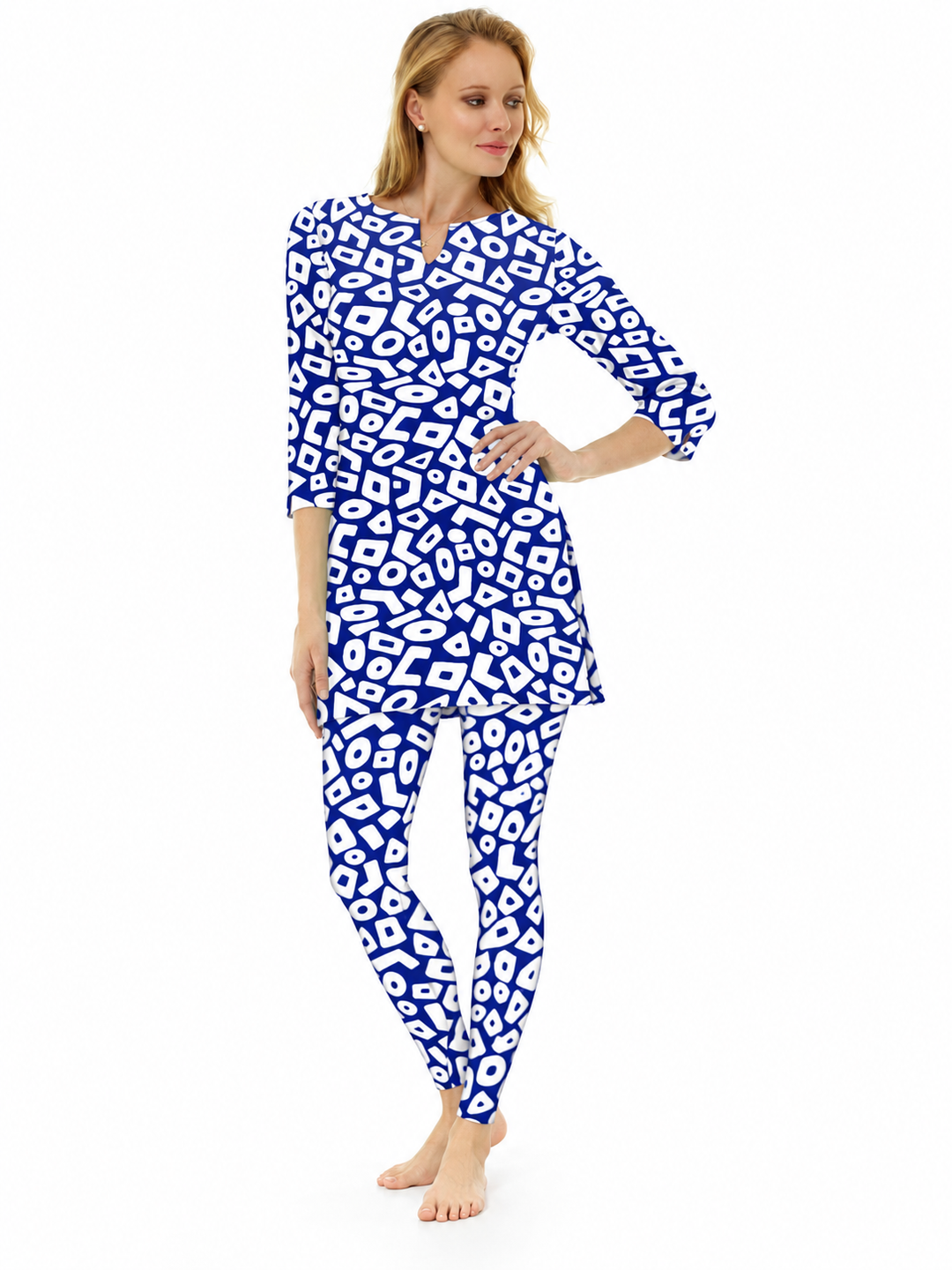 Woman wearing the Navy nylon slit neck tunic and matching leggings, 2 piece set