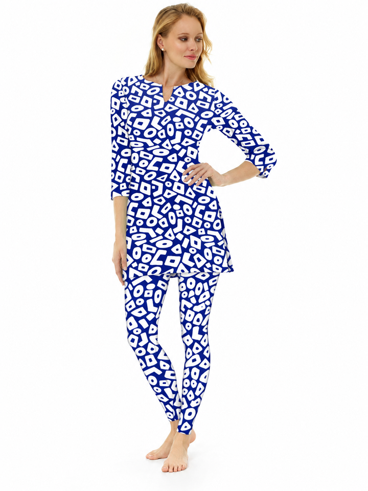 Woman wearing the Navy nylon slit neck tunic and matching leggings, 2 piece set