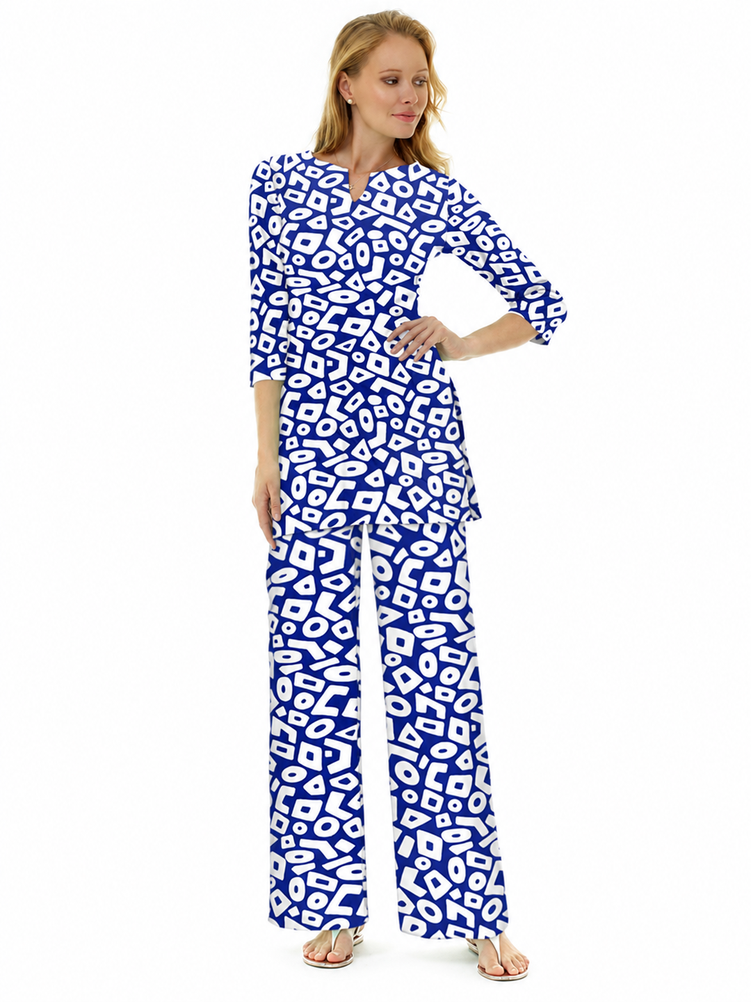 Woman wearing the Navy nylon slit neck tunic and matching palazzo pants, 2 piece set