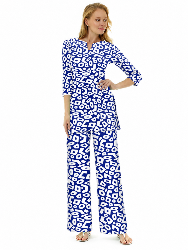 Woman wearing the Navy nylon slit neck tunic and matching palazzo pants, 2 piece set