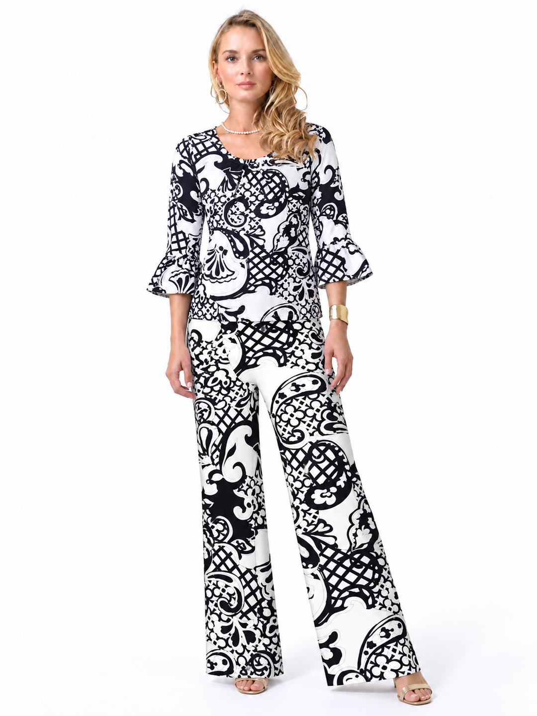 Woman wearing the Black White nylon ruffle sleeve top and matching palazzo pants, 2 piece set