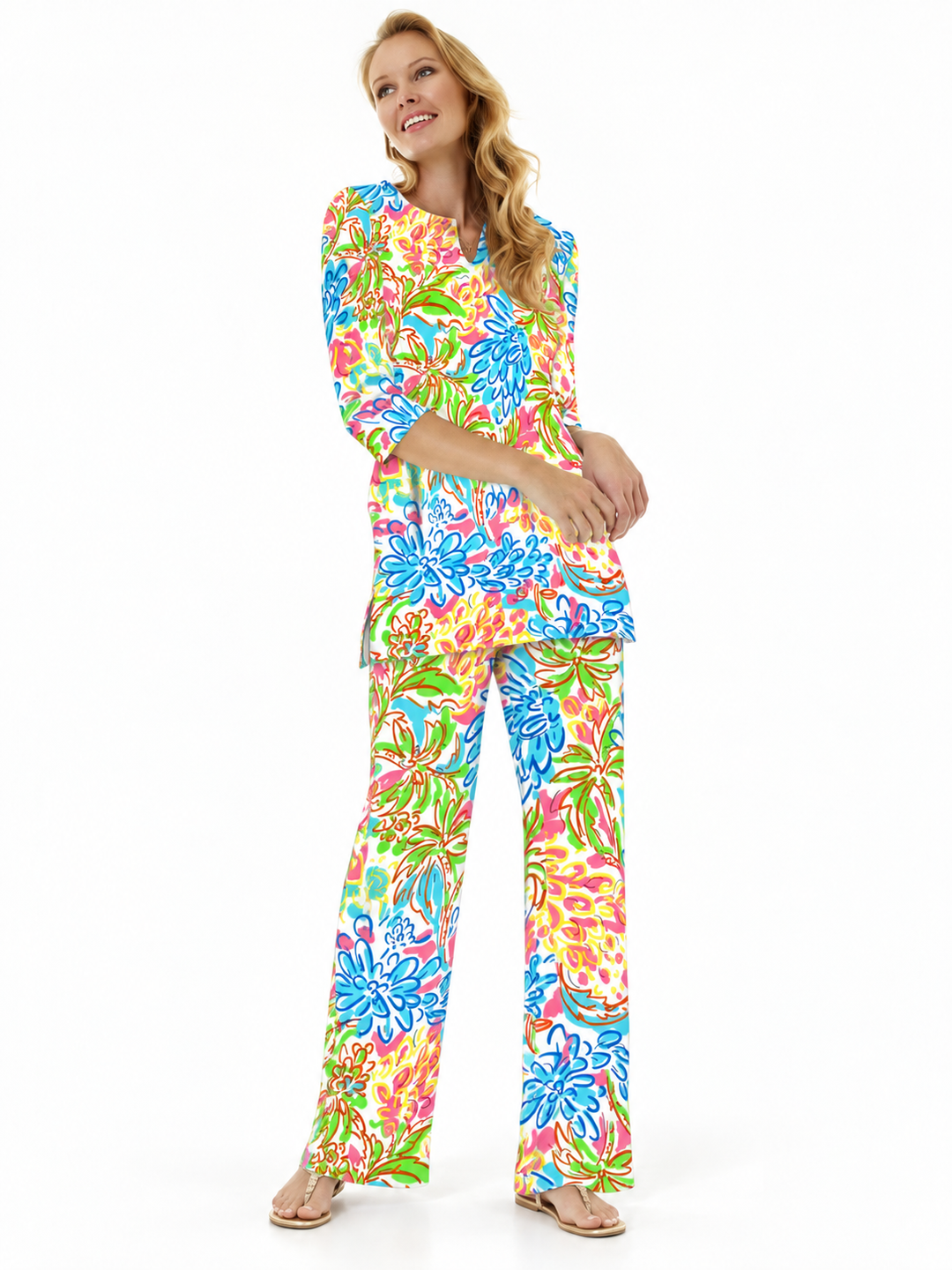 Woman wearing the Tropical Multi nylon slit neck tunic and matching palazzo pants, 2 piece set