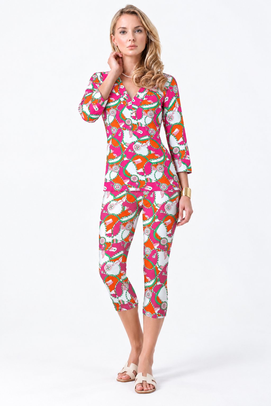 Woman wearing the Tangerine Pink nylon top and matching capri, 2 piece set