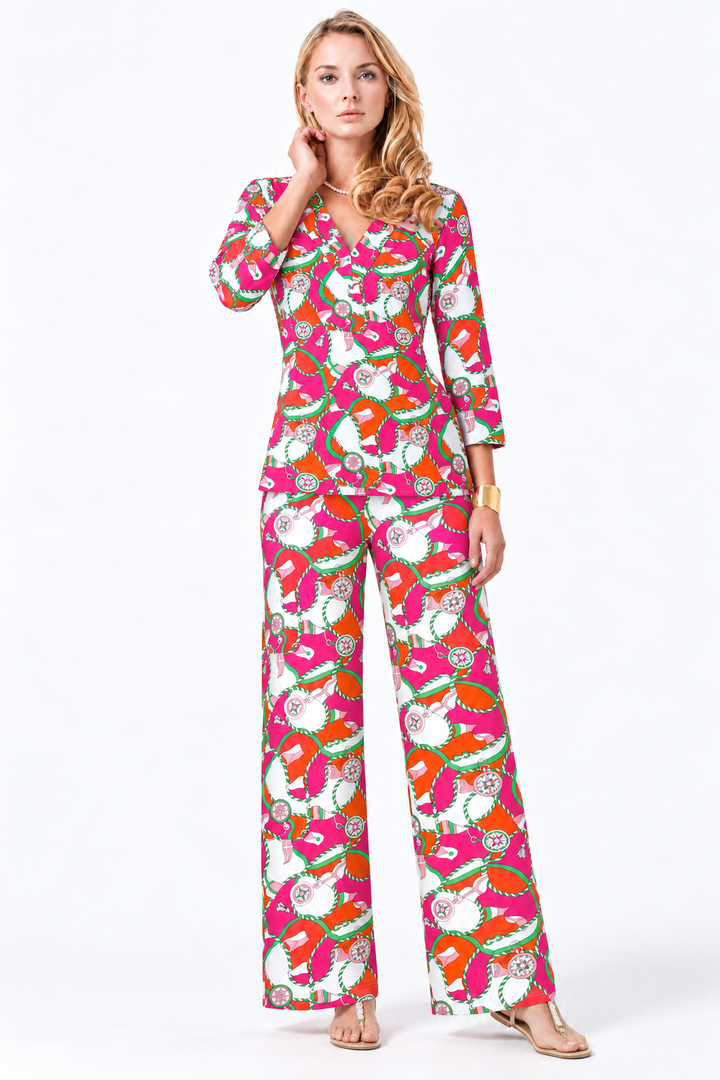 Woman wearing the Tangerine Pink nylon top and matching palazzo pants, 2 piece set