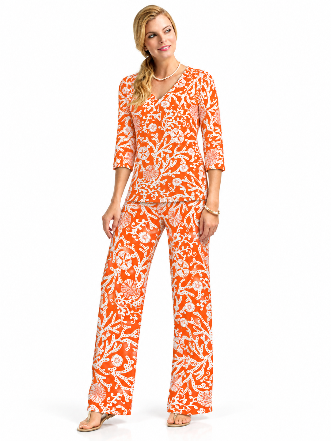 Woman wearing the Deep Orange nylon top and matching palazzo pants, 2 piece set