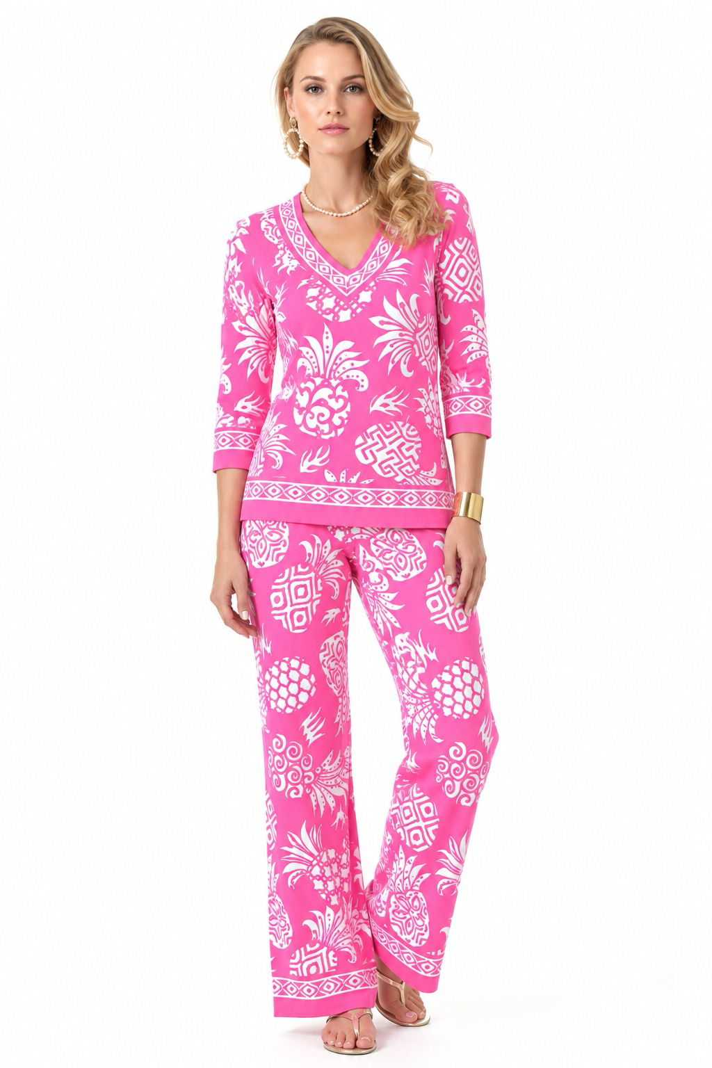 Woman wearing the Pink Pineapple knit top and matching palazzo pants 2 piece set